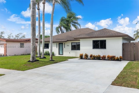 Photo of 711 NW 8th Ave, Dania Beach, FL 33004 (MLS # A12104494)