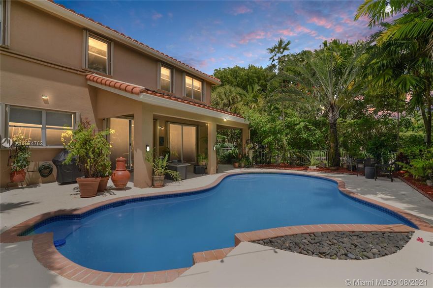 Come see this beautiful 5 bedroom, 2.5 bathroom home situated on a corner lot within the gated community of Pembroke Shores. All bathrooms upgraded & the MasterBathroom NEWLY remodeled into a beautiful, serene spa-like room w/new Roman Bathtub. Home features tile on first floor, engineered wood on staircase, bedrooms and the hallway upstairs. Upgraded kitchen in 2016 w/granite countertops, 42" wood cabinetry & SS appliances. 5th bedroom currently a sitting room & can easily be converted back to 5th bedroom.  Enjoy your pool, which can be kept warm throughout the year thanks to solar panels, roof replaced in 2016/17, two AC units approx 8 yrs ago, new tankless water heater 3.5 yrs ago & generator approx 2 yrs old. Lake seen from part of home. Excellent Schools & great shopping nearby.