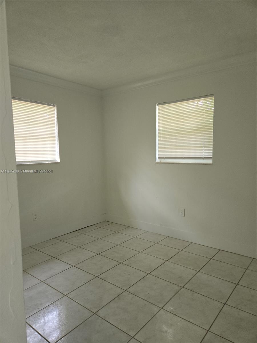 Great corner 2?bedroom, 1?bath single-family home on a spacious corner lot (4,031?sq?ft). Features include tile flooring throughout, in-unit washer and dryer, and a carport. Centrally located in West Park with easy access to schools, highways, shopping, and community amenities. Move-in ready and awaiting your personal touch