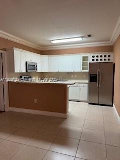 Welcome to this spacious 3-bed, 2-bath two-story condo in one of Miami’s most desirable areas. Enjoy the rare convenience of a garage entrance on the first floor, offering direct access and added privacy. Upstairs, an open-concept layout features a bright living and dining area, modern kitchen, and high ceilings that enhance natural light. The primary suite includes an en-suite bath and ample closet space, while two additional bedrooms provide flexibility for guests or a home office. Located in a well-kept community near highways, shopping, dining, schools, and beaches, this condo offers the ideal mix of comfort, style, and location. Don’t miss it!
