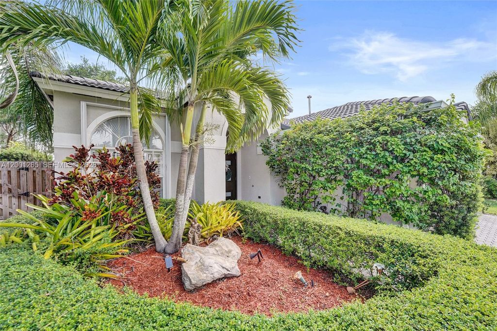 Photo of 1445 NW 143rd Ave, Pembroke Pines, FL 33028 (MLS # A12001265)