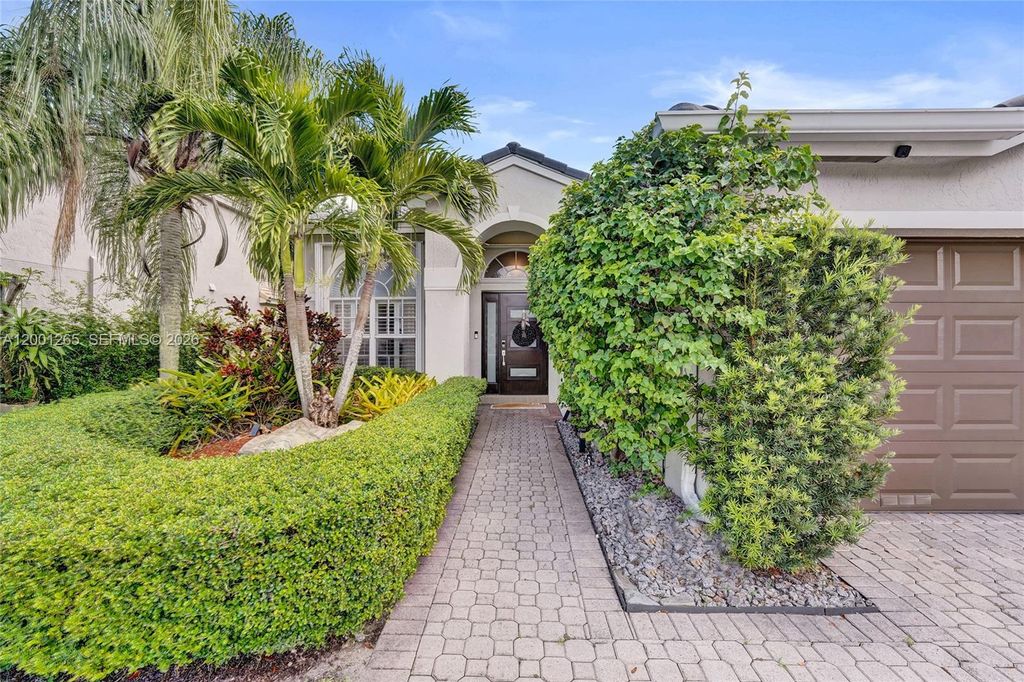 Photo of 1445 NW 143rd Ave, Pembroke Pines, FL 33028 (MLS # A12001265)