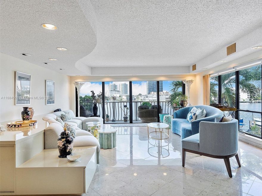Welcome to CAPTAINS PARADISE, this beautiful residence features 3 bedrooms/3 bathrooms in suite, 2550 sq ft of living space, 800 sq ft of wrap around balcony space overlooking the Golden Isles Lake, foyer, formal dining/living space, spacious kitchen with ss appliances & newer counter tops,laundry room,storage area,Intracoastal and Ocean access from your own private dock up to 65'(offered separately).Flooring consists of marble/ceramic tile,bar area,built ins,large walk in closets,2 assigned covered parking spaces.This boutique building with only 2 residences per floor,offers a swimming pool, BBQ area, gated access,and it is located minutes from restaurants, shopping; within walking distance to the beach, close to the Fort Lauderdale International Airport, Aventura Mall and Gulfstream.