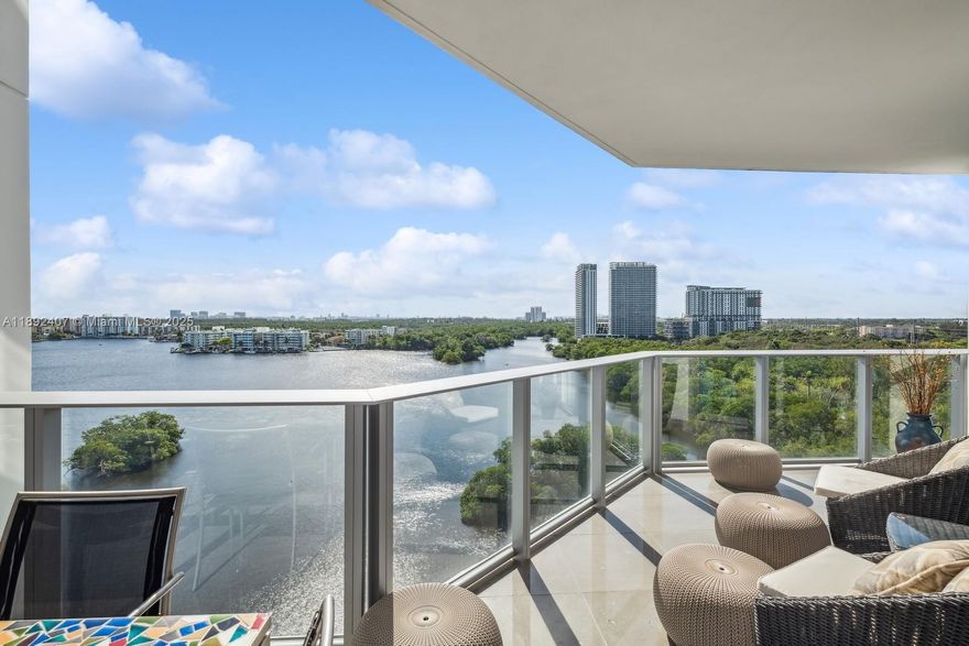 A magnificent and impeccable residence specially designed and upgraded throughout. This spacious 2 Bed+Den+3 Full Bath offers the highest technology with outstanding finishes, including a state-of-the-art Italian gourmet kitchen, custom-made doors, elegant ceilings with additional lines of illumination, ample closets, and ensuite baths. Enjoy breathtaking South East views of the Sunny Isles Intracoastal Bay, nature preserve, and ocean. This is a guard-gated community with a private marina with 40 - 100' slips and a boat club with many choices of water sports. The spectacular amenities include a spa, kids' playroom, news café, valet, concierge, and more! Covered parking space and storage under AC. Minutes away from world-class shopping, Bal Harbour-Aventura Mall, fine dining, and more!