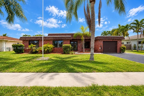 Photo of 8131 NW 68th Ave, Tamarac, FL 33321 (MLS # A12098144)