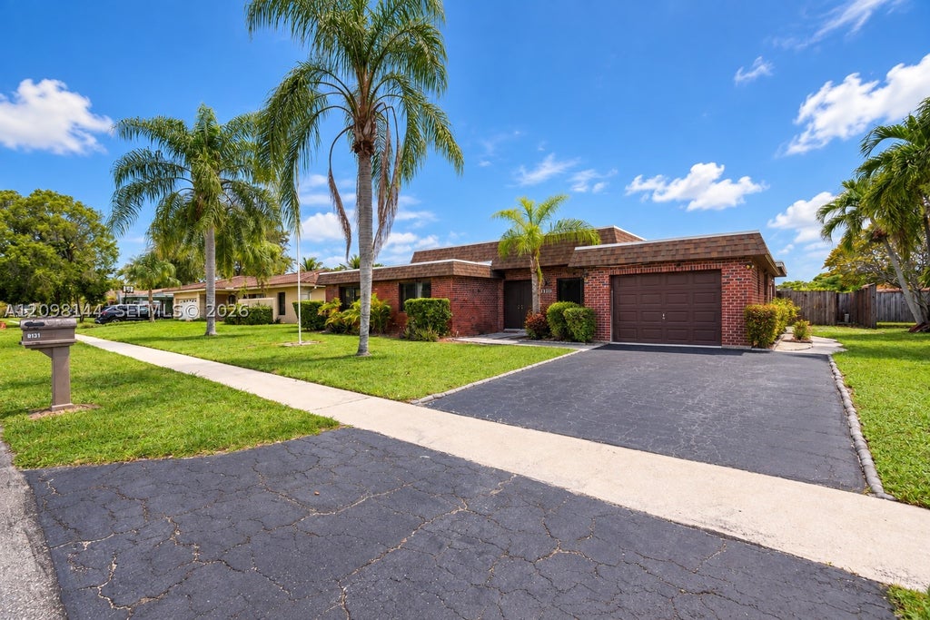 Photo of 8131 NW 68th Ave, Tamarac, FL 33321 (MLS # A12098144)