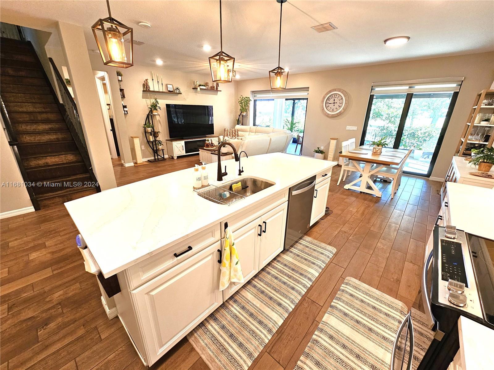 Located at the cul-de-sac, one of the largest lots in the Woodmont Country Club, it is golfer’s dream! Built in 2023, this new home guarantees low homeowner’s insurance premium (only $3,535 per year). Over $200k in custom upgrades: no carpet anywhere, whole house Waterlux water filtration and reverse osmosis drinking water system, ozone laundry system, built-in closets & entertainment unit upstairs, smart window blinds (blackouts in all bedrooms), smart appliances, designer kitchen upgrades, custom stair railings, pocket patio doors, huge luxury screened-in lanai with travertine floor, fire pit, BBQ area, fully fenced with privacy hedges, unmatched views and privacy. Walking distance to the clubhouse with a resort-style pool, pickleball & tennis courts, golf pro-shop, restaurant, bar.