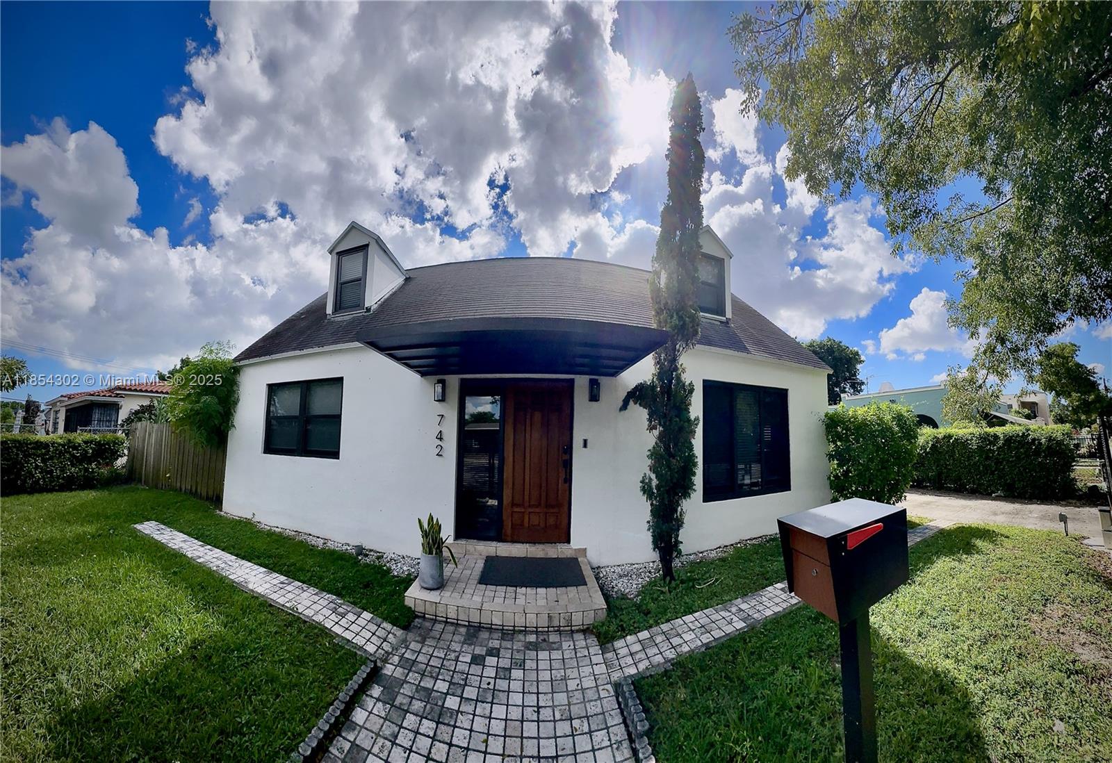 Fully furnished or Unfurnished cozy Single Family Home with 4 beds and 2 full baths. High impact windows and doors all throughout the property, fully fenced front and back with motorized gate. The property has a large backyard with covered wooden terrace and fruit trees. Completely private backyard. The driveway Fits up to 3 vehicles inside gated driveway, street parking is also an option. Very nice and friendly neighbors Located in the most trending area in Miami, close to Wynwood, The Design District, Edgewater, Jackson Memorial, Miami Beach, Brickell, Downtown etc. Pets allowed with a Fee. Please check 360 virtual Tour on listing and contact Listing Agent for videos and virtual showings.