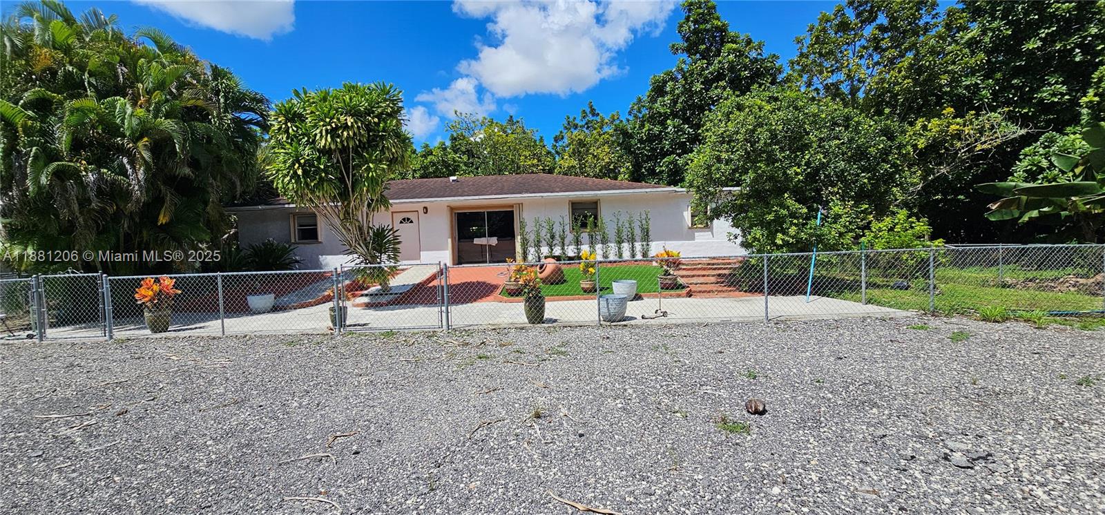 Rare Opportunity !! Discover the perfect blend of country living, income potential, and agricultural lifestyle on this 2.5-acre income-producing mamey grove. Fully fenced and equipped with its own irrigation system, this property offers endless opportunities. The 1,400 sq. ft. 4-bedroom, 2-bath home provides comfortable living, while a separate 1-bedroom, 1-bath efficiency with kitchen is ideal for guests, extended family, or rental income. Equestrian and farming enthusiasts will appreciate the 8 stables, plus an 800 sq. ft. poultry house/stable for animals or storage. A private RV entrance adds even more flexibility. Whether you’re looking for a working farm, horse property, or investment retreat, this property delivers it all.