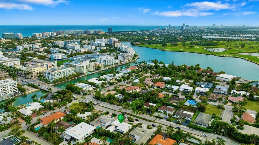 Located in Bay Harbor Islands, one of the most coveted neighborhoods in Miami, is this 5090sqft mid-century modern home rebuilt in 2009! This exquisite property has 4 large ensuite bedrooms, an expansive office and a spacious den. Other features include high ceilings, impact windows, natural woods, stone accents, smart home technology, surround sound, electric blinds, and redone electric & plumbing. The chef's kitchen has top-of-the-line Miele and Subzero appliances. The primary suite includes 3 closets, a spa-like bath with a multi jetted shower and a balcony. Paradise is in the backyard with a custom pool, jacuzzi, sun shelf, summer kitchen, pergola, pool bath, lush landscaping & a butterfly garden. Amazing location: walk to the beach, cafes, shopping, A+ schools, tennis & parks. NO HOA