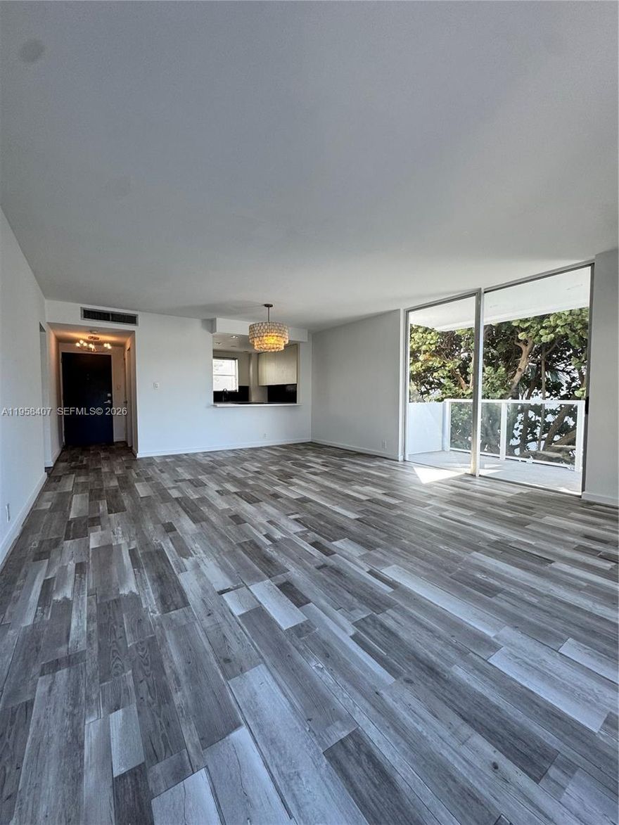 Spacious 1-bedroom, 1-bath corner unit with den, featuring new floors and fresh paint, ready for immediate occupancy. The additional den space is ideal for a home office or flexible living area, while the corner layout offers excellent natural light and added privacy. Three closets, including a walk-in, provide ample storage throughout the unit.

Located in the secure, gated Bay Park Towers, the community offers a 24-hour guard gate, swimming pool, and beautiful Biscayne Bay views. Shared laundry rooms on every floor. One assigned parking space included, with additional parking and guest spaces available. 

Enjoy an unbeatable walkable location just steps from Midtown and the Design District, and close to Whole Foods, Starbucks, and Walgreens. Cable, internet, and water included.