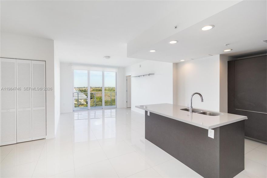 LUXURIOUS AND EXCLUSIVE UNIT IN MIDTOWN DORAL. This 2-bedroom, 2-bathroom residence features a European-style gourmet kitchen with quartz countertops and Bosch appliances, smart home technology, and elegant porcelain floors throughout. Enjoy impact-resistant windows and the convenience of 2 assigned parking spaces. Ideally located with immediate access to the Turnpike and Palmetto Expressway, and just minutes from top-rated schools, major shopping centers, and Publix. The building offers 24-hour concierge service.