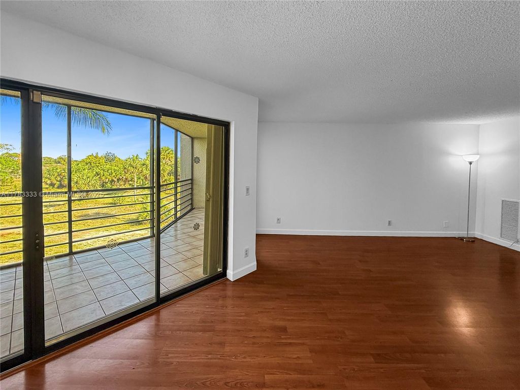 Photo of 5700 Camino Del Sol #303, Boca Raton, FL 33433 (MLS # A11783333)