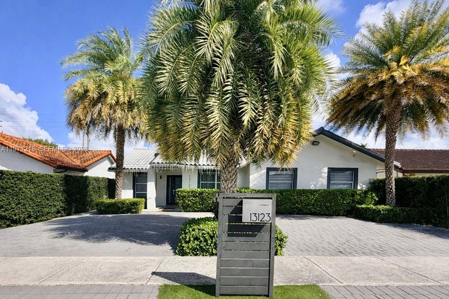 Great opportunity to own a well-maintained 4/2 home close to schools and transportation. Updated kitchen and bathrooms, all-tile flooring, covered terrace, lush landscaping, and side space for boat parking.