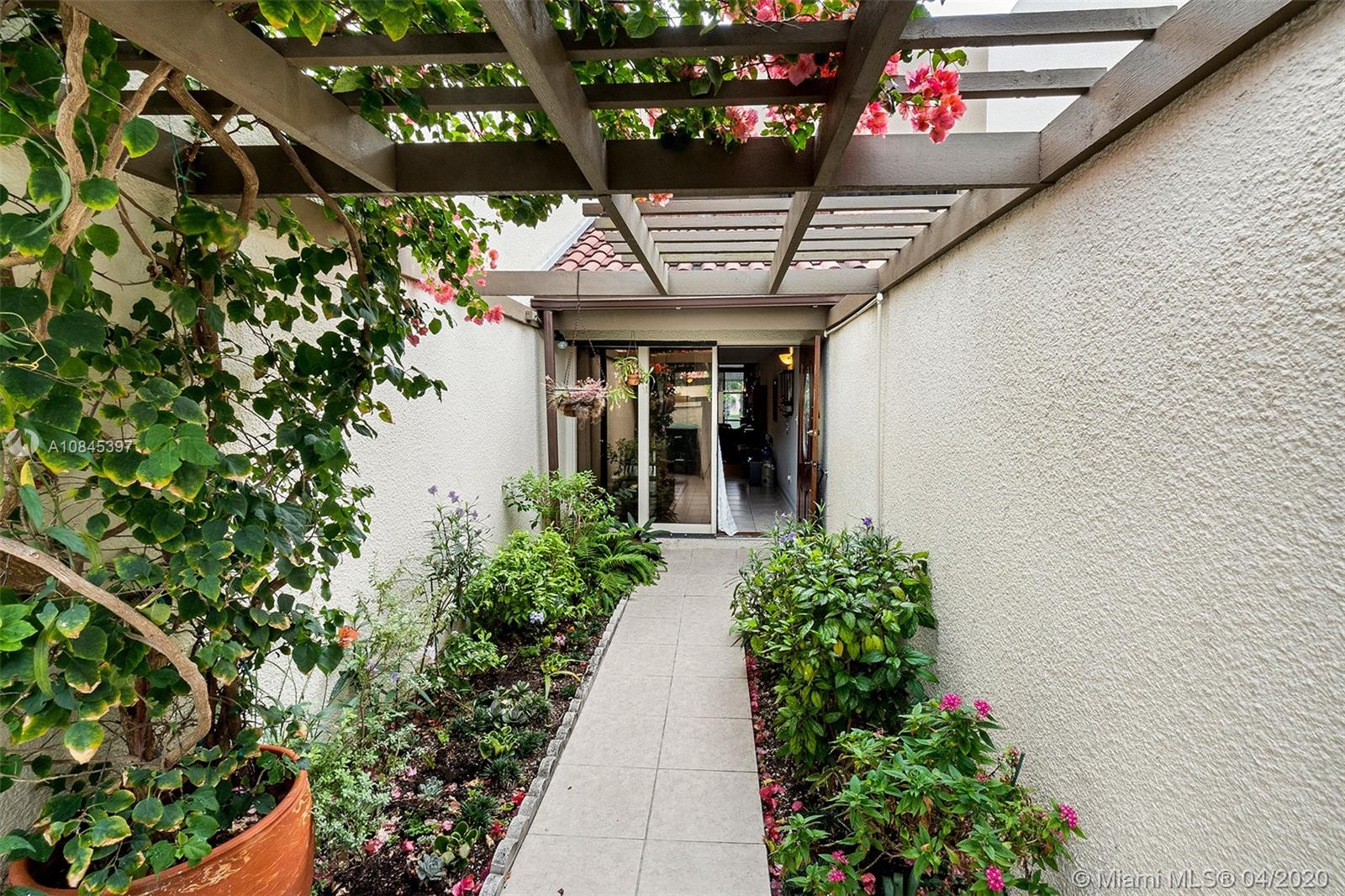 Bright and spacious 3/3 townhouse in the beautiful and well maintained gated community of Dadeland Walk. Best spot within the community, with direct access to tennis courts, tennis practice wall, pool and gym. Wooden cathedral ceiling. Kitchen & baths with wood cabinets & granite counters. New high-end washer and dryer. Renovated faucets, showers and entrance floor. Super large walk-in closet in master bedroom, 2nd bedroom has a private bath. 3rd bedroom or den on 1st floor next to a full bathroom. Open living areas with view to a private screened back patio with bbq. Storage room. Accordion hurricane shutters. Two parking space assigned. Steps away from Dadeland Mall, Baptist Hospital, Metrorail, US1, Palmetto, supermarkets, & fine restaurants.