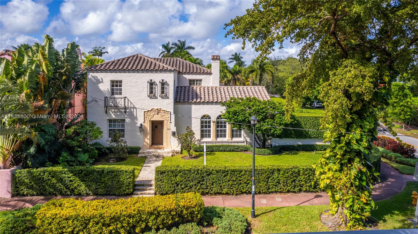 Magnificent Italian Villa situated on a corner lot with impeccably manicured, privacy landscape, on prestigious Pinetree Drive near La Gorce Country Club and the beaches. This 5-bed 5-bath home has stunning original details throughout, dramatically oversized arched doorways, living room with soaring cathedral-beamed ceilings and fireplace, French doors connecting to the enchanting patio and backyard, and beautiful Arabesque-tile floors. All bedrooms are large with renovated en-suite baths and closets, family room upstairs, detached guesthouse with kitchenette, and 2-car garage and driveway for multiple vehicles. Phenomenal backyard with pool, covered patio for lounging, and great space for enjoying Miami’s 365-day summer! This gated, 9,200-SF property is a rare find!