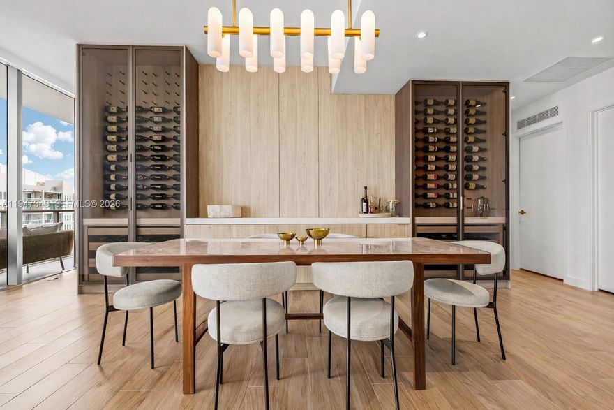 Soak in panoramic sunrise-to-sunset views of the Downtown Miami skyline and bay from this expansive 3-bedroom, 3.5-bath corner residence. Thoughtfully designed with refined Italian terrazzo and quartz countertops, the home features a custom walk-in pantry, dedicated laundry room, bespoke closets and a striking custom wine display. European porcelain tile floors blend seamlessly with engineered wood, while nearly 2,000 square feet of interiors are complemented by 477 SF wraparound terraces ideal for indoor-outdoor living. Residents enjoy world-class amenities including a dramatic rooftop pool, garden-level lap pool, cabanas, jacuzzi, poolside service, full-service fitness and wellness facilities, Cipriani dining and gourmet market, children’s playroom, 24-hour concierge and butler services, plus two valet parking spaces and a 4'x 8" air-conditioned storage.