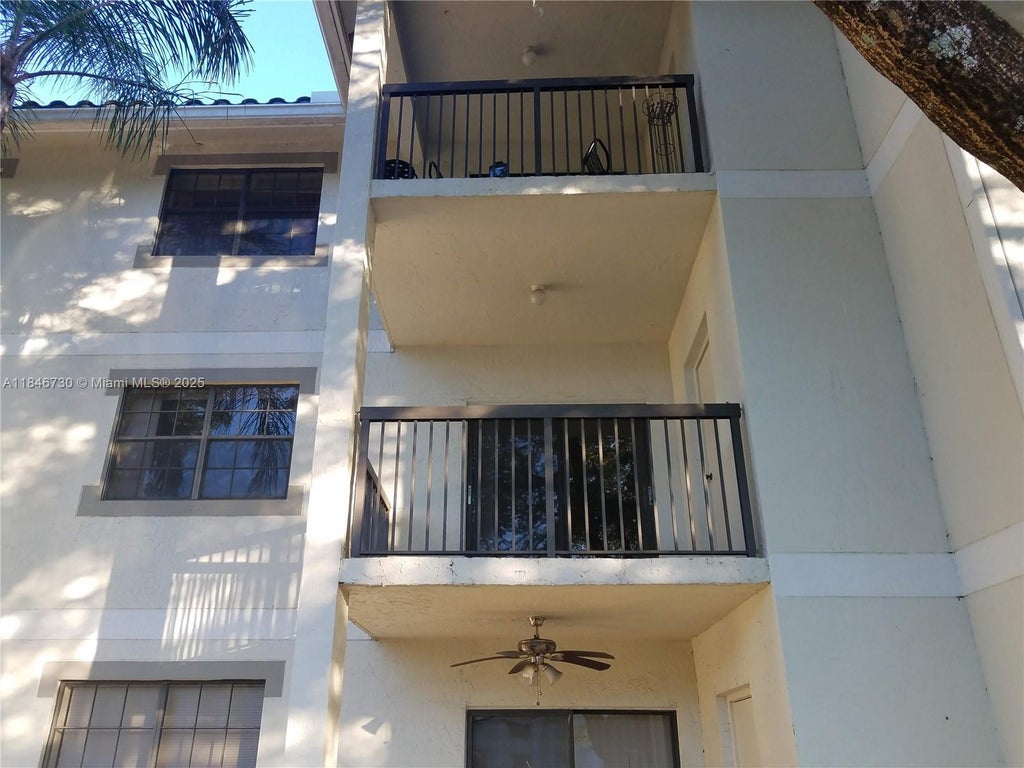 Photo of 11211 W Atlantic Bl #302, Coral Springs, FL 33071 (MLS # A11846730)