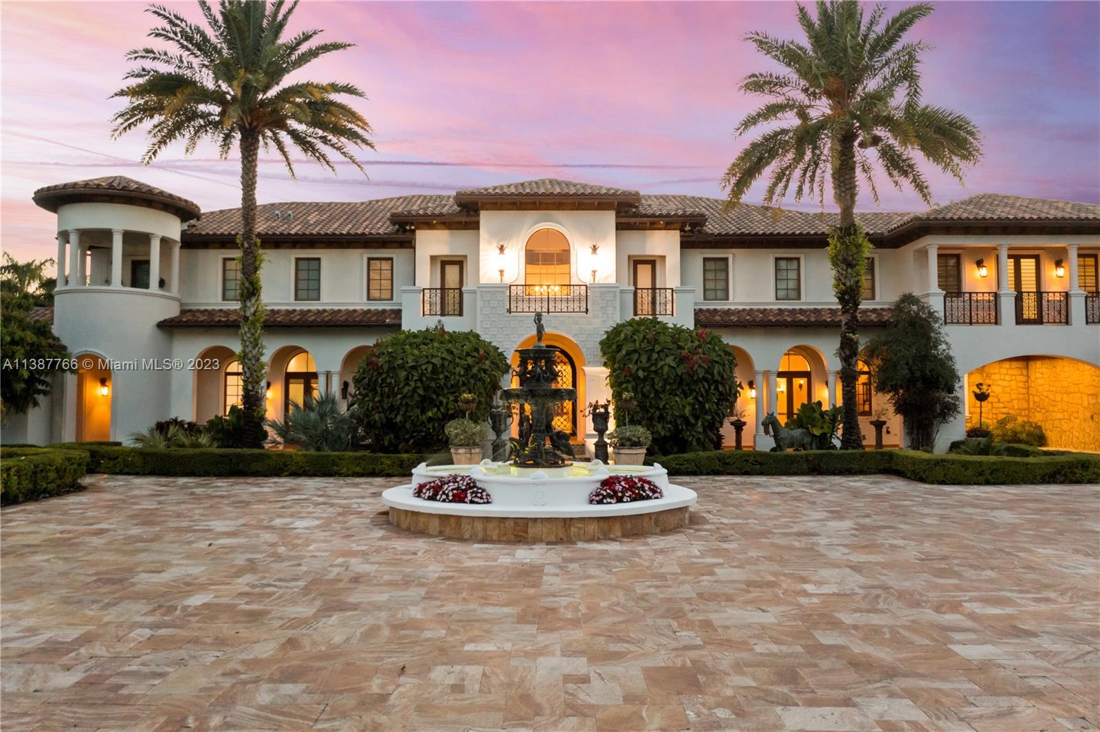 Introducing a luxurious masterpiece in Miami's Horse Country. This stunning estate sits on a sprawling 4.2 Acre compound that offers privacy & seclusion. Immaculately designed, the property showcases stunning grounds, resort-style amenities with an array of top-of-the-line features. A lagoon-style pool, swim-up bar & outdoor kitchen offer luxury & relaxation while a hidden cave with a slide adds a touch of adventure. Wine cellar, pub bar, game room, theater & separate party pavilion invites an infinite array of entertainment options while a magnificent barn caters to car enthusiasts. With an separate office/gym & elevator for seamless access, this home defines convenience. Immerse yourself in a world of lavishness and refinement as you enjoy the serenity of this remarkable estate.