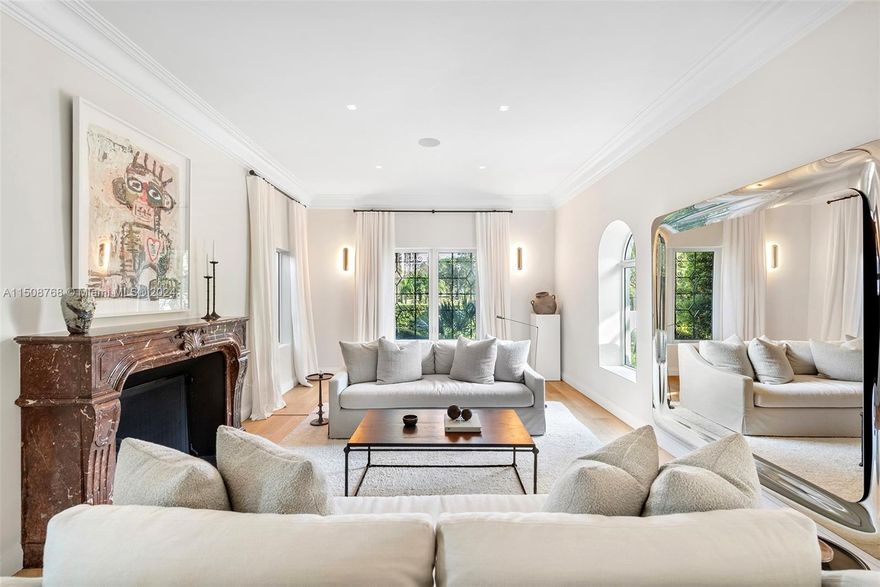 No expense was spared while remodeling this gated 2-story, 5-bed/ 3.5-bath home on prestigious Pine Tree Drive! Standout details include a large Arrital Italian kitchen w/ Miele and SubZero appliances, butler’s pantry, formal dining room, home theater, summer kitchen & stunning bath w/ book-matched Arabescato marble. Modern finishes include impact windows, new oak flooring, linear diffusers, Smart Home Crestron system controlling lighting, shades & 5 music zones, mosquito system and security cameras. A large living room w/ a Louis XV gas fireplace shipped from Europe & spacious backyard overlooking lushly manicured grounds. Oversized primary suite with a generous walk-in closet & marble bath exudes luxury. Premier neighborhood close to beach, A+ schools, La Gorce Country Club & top dining.