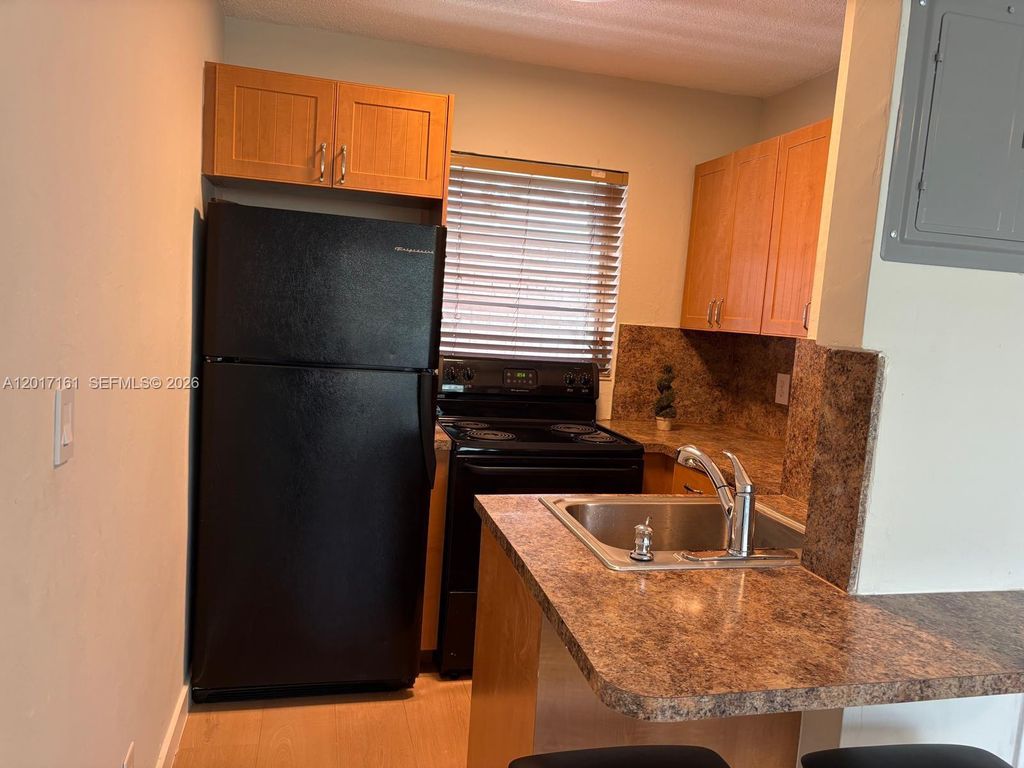 Photo of 3212 NE 7th Pl #10, Pompano Beach, FL 33062 (MLS # A12017161)
