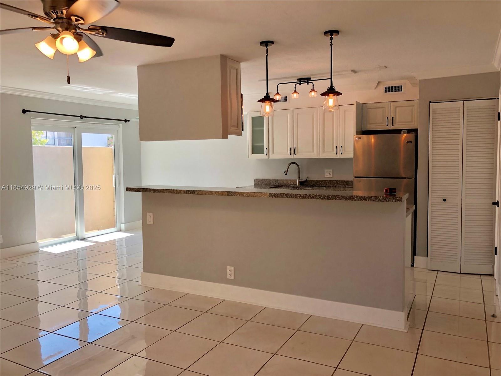 Renovated and sparkling clean townhouse located on a quiet street in Palmetto Bay. Open plan living room, kitchen, dining, and half bathroom are on the ground level; spacious 2 bedrooms and full bathroom on a second level. Walk-in closet has convenient built-ins in Primary bedroom with small loft above it. New hurricane Impact windows and doors, screened private patio, granite countertops, spacious pantry, eat-in kitchen. Near The Falls Mall, LA fitness just a moment away. Easy access to US1 and Turnpike