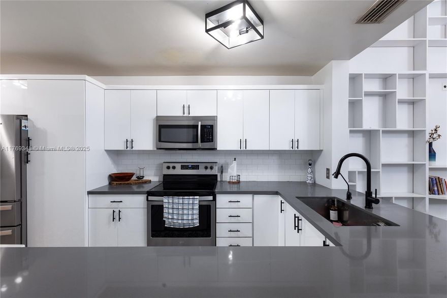 You might fall in love! Come for a visit, and find yourself wanting to stay permanently! This beautiful home has all the right touches, tastefully updated for a modern and comfortable feel. Full size washer/dryer, stainless steel appliances, laminate throughout, tons of storage (including a loft off the primary; it can be easily rearranged to open to the living area instead), and a trendy back screened patio for ultimate relaxation. The layout and flow of the home is bright and open, with additional storage room in the patio, and off the side of the home. There is a large beautiful tree gazing over the lake that creates yet another tranquil space to take in the beautiful SFL weather and views. Wifi, Cable, Roof, Maint incl in assoc fees. Welcome home! Ask about piggyback & DPA loan options