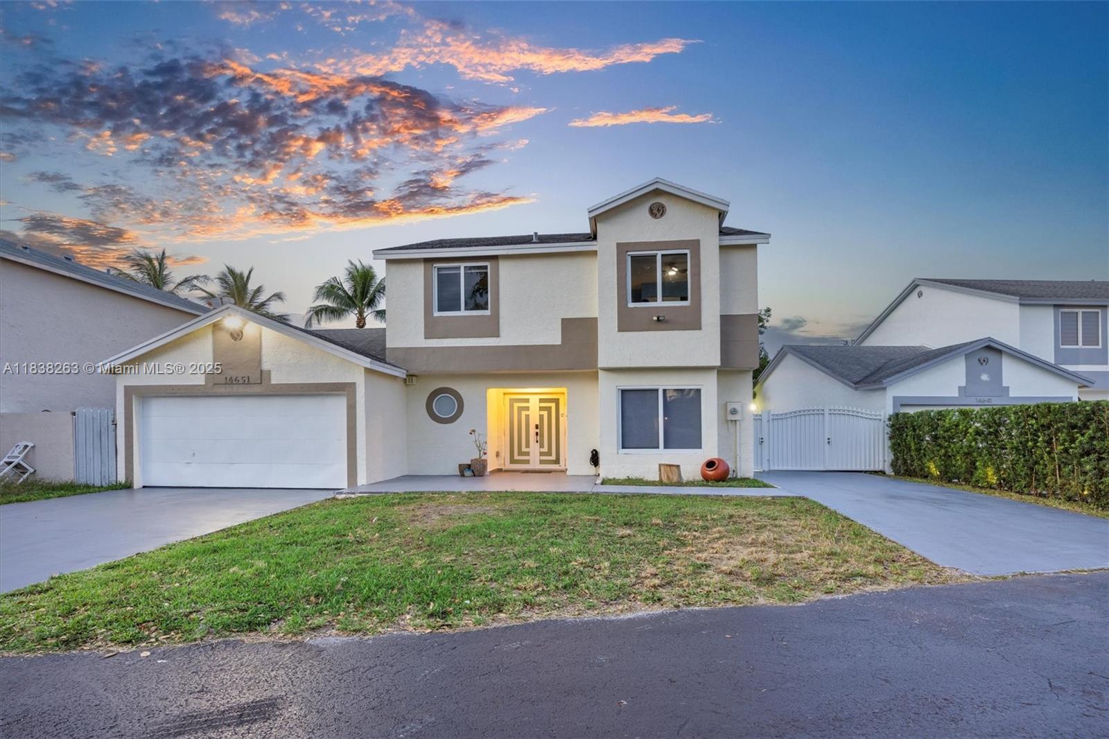 Beautifully remodeled two-story home offering flexibility and space with 6 bedrooms and 4.5 bathrooms. Impact windows and doors, 5 year old roof, is fully remodeled bathrooms and new floors. The main level features 2 bedrooms and 2.5 bathrooms, ideal for added privacy or convenience. Upstairs, you'll find 4 additional bedrooms and 2 full baths. One bedroom and full bath functions perfectly as guest quarters and has a separate entrance. Enjoy cooking and entertaining in the full outdoor kitchen, with a backyard with mango trees and that has room to add a pool. Features include impact windows and doors, new flooring, and a generous walk-in pantry. Ideally situated near top-rated schools, shopping and main roadways. Low HOA