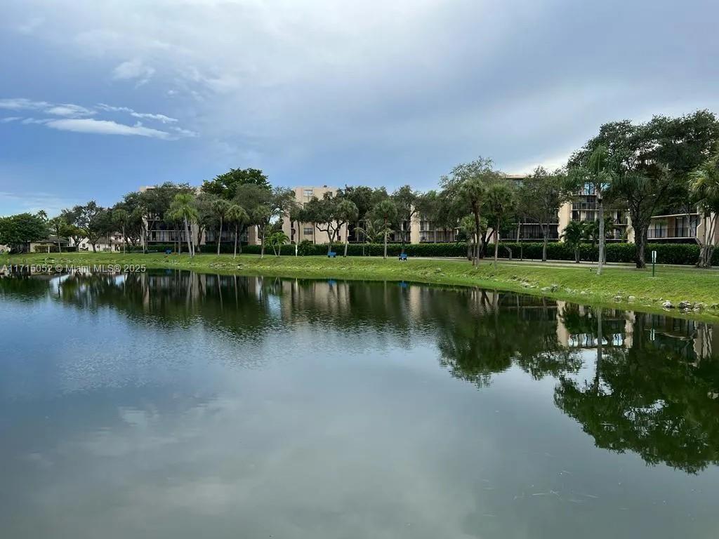 Motivated Seller! Prime location near the main highways. Excellent, bright and spacious 4th floor unit with beautiful views from the large and spacious patio. This 2/2 property features tile flooring, bright cabinetry, spacious bright living area overlooking the oversized covered patio. Bedrooms are generously sized with plenty of storage space and walk in bathrooms in both rooms. It includes washer and dyer inside, community fitness room, tennis court, pool, basketball court, and a serene community walking trail along the lake. A Must See! Book your showings!