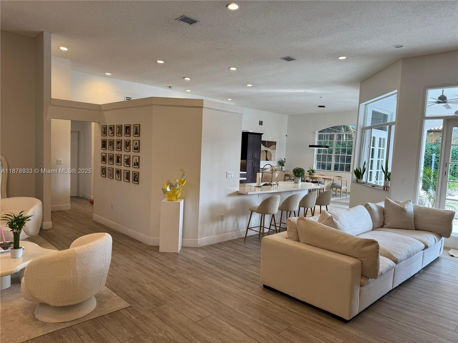 Wake up to sunshine and serenity in this luminous 5-bedroom retreat in The Falls, designed for effortless living and entertaining. Located on a quiet street with great curb appeal, features an open layout filled with natural light, a large kitchen with stainless steel appliances, and a dining area overlooking the pool. Spacious primary suite with walk-in closets and French doors to the backyard. Enjoy a covered outdoor living space, pool, jacuzzi, and recently installed metal roof. Pool bath, laundry room, and 2-car garage complete the home. A must-see! *Currently undergoing renovations with expected completion in July 2025—offering the perfect opportunity to move into an upgraded and refreshed home.