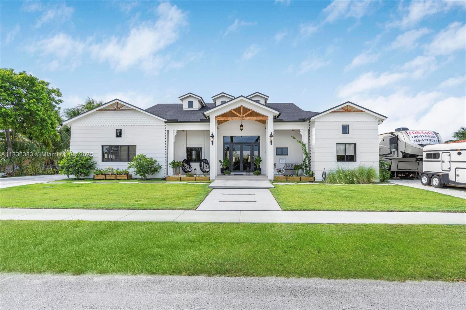 Completely remodeled in 2024, this 4BR/3,2 half bath (+den) home offers the finest comfort and style. Enjoy the warmth of wood-beamed terrace ceilings and corbels while also appreciating the airy 16-foot ceilings and skylights indoors. The living room features 20-foot sliding impact doors that seamlessly connect the indoor and outdoor spaces, offering a breathtaking view of the lake. The chef's kitchen features wooden cabinetry, a 10-foot island, and quartz countertops. Each bedroom boasts its own walk-in closet and blackout shades. The master suite features an 11-foot, two-person walk-in shower and electric shades, while elegantly arched hallways add charm. The versatile living spaces include an optional in-law suite with a bathroom. Too much to mention! Also for sale: MLS #A11813737.