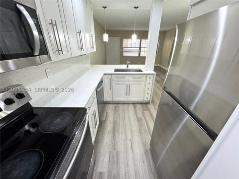 Photo of 2626 Riverside Dr #2626, Coral Springs, FL 33065 (MLS # A12098534)