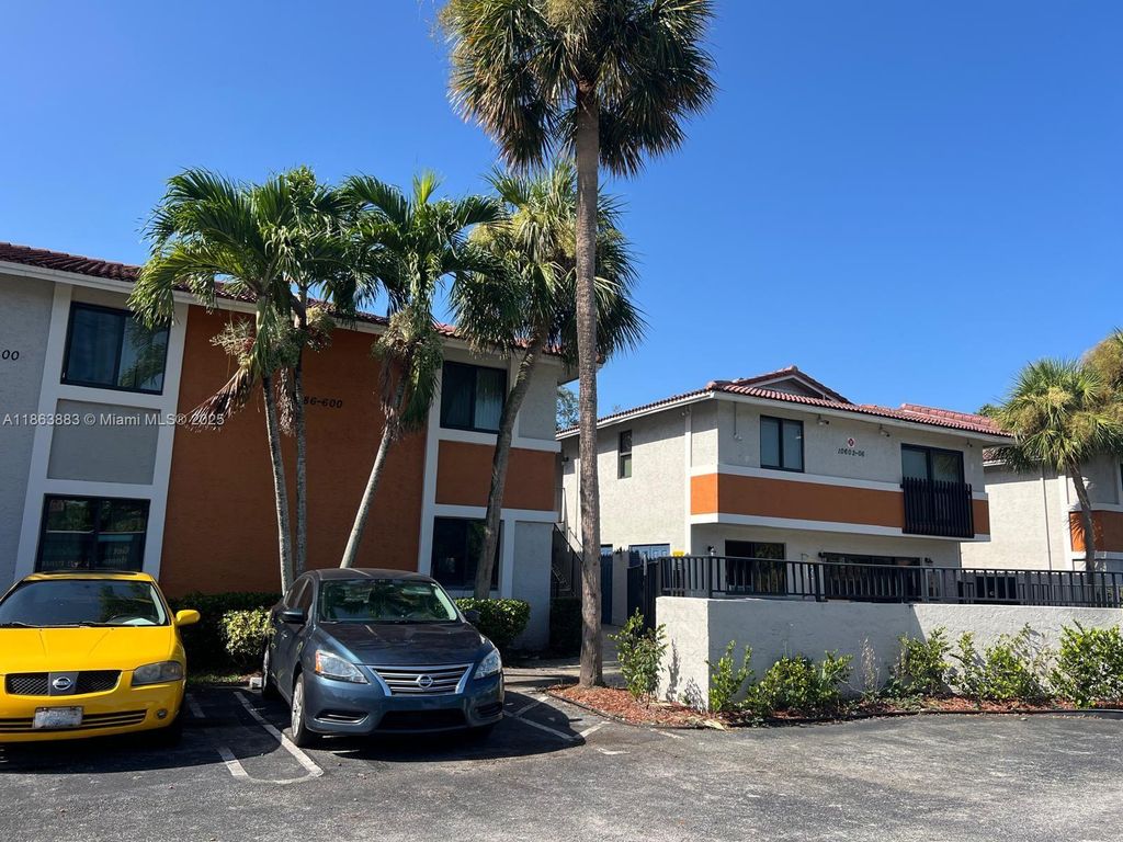 Photo of 10592 Royal Palm Blvd #10592, Coral Springs, FL 33065 (MLS # A11863883)