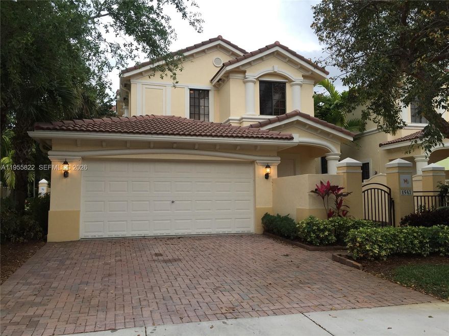Beautifully upgraded 4-bedroom, 2.5-bath home located in the heart of Weston, within walking distance to Weston Town Center. Situated in the desirable gated Mariposa community, this spacious residence features a Triple-split floor plan offering privacy and functionality. Interior highlights include tile and wood laminate flooring throughout, upgraded kitchen,  and abundant closet space.
The primary suite offers a large en-suite bath and generous walk-in closet. Enjoy indoor-outdoor living with a large screened balcony/patio, perfect for relaxing or entertaining, and a charming courtyard-style entrance.

Additional features include a 2-car garage with large driveway, laundry room, and a brand new roof providing extra peace of mind. The association covers exterior maintenance, roof, painting, insurance, landscaping, and security. Ideally located across from The Club at Weston Hills, close to A+ schools, shopping, dining, and major highways.