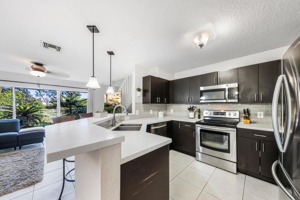 Photo of 8945 NW 38th Dr #17, Coral Springs, FL 33065 (MLS # A11917010)