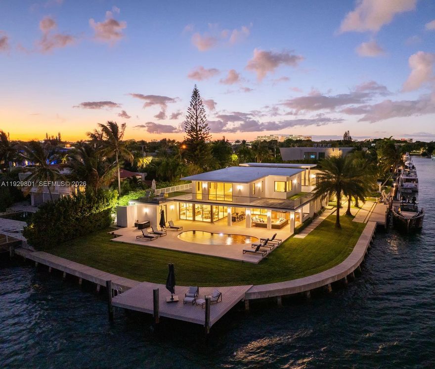Set on a rare 18,253 SF point lot with an extraordinary 264 feet of open Biscayne Bay frontage, this impeccably renovated private gated estate within the guard-gated San Souci community is a true trophy offering.  A dramatic foyer opens to a sun-filled great room with soaring 20-foot ceilings and walls of glass. The residence features six luxurious suites, including one with a private entrance, expansive living and dining areas for endless entertaining, and a fully appointed chef’s kitchen. The entire upper level is devoted to a grand primary suite with an oversized walk-in closet, spa-like bathroom, and wraparound terrace with breathtaking views. Recent upgrades include a new roof, improved seawall, and fully refinished exterior with new paint, plus much more. Come enjoy life on the bay!