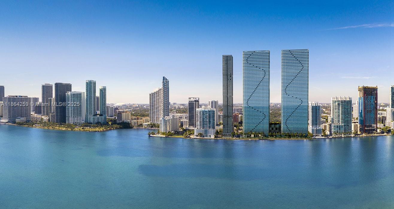 A brand-new chapter of waterfront living begins at the 26th floor at Aria Reserve, Miami’s most anticipated waterfront address. This never-lived-in 2025 residence delivers three bedrooms and three bathrooms, curated for both sophistication and ease. Floor-to-ceiling impact glass windows fill the space with natural light to frame uninterrupted views of Biscayne Bay, the Atlantic Ocean, and the Miami skyline. Porcelain tile extends seamlessly inside and out. The open layout sets the stage for effortless entertaining, offering a sleek gourmet kitchen with engineered stone surfaces, full-height backsplash, and professional-grade appliances. Every detail was chosen to elevate everyday life into something extraordinary. Prime location minutes away from Design District.