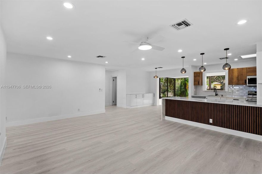 Stylish masterpiece in the heart of Hallandale! Ideally located just minutes from the ocean, beaches, shopping, dining, and major highways. This beautifully updated single-family home features a brand new roof (2026) and brand new hurricane-proof impact windows and doors. A true must-see offering a spacious 2-bedroom, 2-bath layout with office and den, plus a huge Florida room overlooking a private backyard oasis. Enjoy a large backyard, big garage, and new washer and dryer. The perfect blend of location, style, space, and functionality. This property will not last long - schedule your showing today!