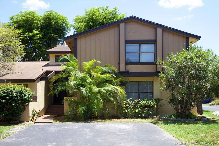 This beautiful Townhouse is the largest model in Woodgate North, which features a huge walk in closet, 2 spacious bedrooms and 2 bathrooms upstairs + a split level den/office that could be a 4th bedroom. Downstairs features 1 bedroom for a private guest or in-law quarters. A beautiful entry way with a very high ceiling that accentuates the spaciousness. A large kitchen with  lots of storage which was replaced in 2014. There is a private backyard with shade trees that catches a nice evening breeze which makes evening barbecues a must. Directly across the street there is lake access and there is attachment only on 1 side as this is situated on a quiet street on the corner. Add to this the very low monthly maintenance fee with pool and tennis courts. A great place to live!!