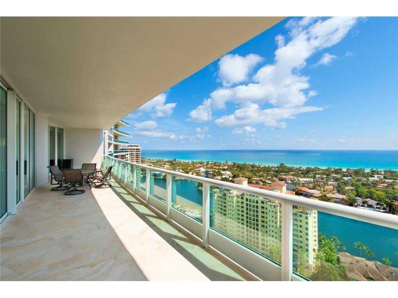 An exquisitely designed Art Deco masterpiece with magnificent rich wood finishes, Lalique crystal accents & glass-like marble floors complient the spacious flow-thru floorplan with 2 Master Suites.His & Hers Master Baths and custom built closets.This SE c orner residence offers spectacular direct &unobstructed sweeping views of the ocean and Turnberry Golf Courses. Porto Vita pampers you with a Restaurant&Bar, Spa&Fitness, Poolside services,Tennis complex.