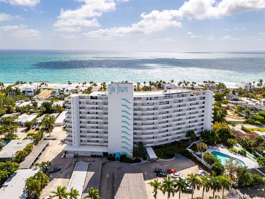 A quiet retreat, across from the beach, where the rhythm of the ocean replaces the noise of the world. Step inside, slide open the floor to ceiling impact doors and take in the gorgeous views of the ocean and towering palms. Sunrise spills across beautiful white porcelain floors in this updated condo with stainless appliances, granite counters and wood cabinetry in the kitchen & bath. Add to this an enormous walk-in closet & 26-foot private terrace. This is your place, tucked away from the crowds, yet close to intracoastal restaurants, bars & shopping.  A mid-century modern architectural gem, this condo has everything - heated pool, secure entry, gym, bike room, BBQ, gated parking, storage & shuffleboard. And it's home to a cool 55+set. Looking for an oceanfront lifestyle without the hefty price tag? Here it is!