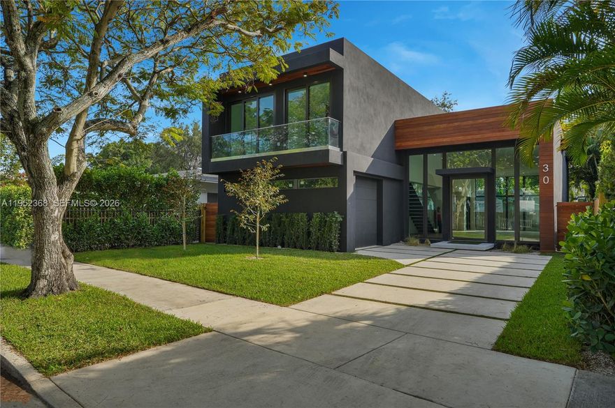 A few blocks from The Miami Design District sits this new construction modern home with 3,642 total SQ/FT. 4 bed/5 bath + den that can be used as a 5th bedroom. Walk through the oversized pivot door and find an open floor plan with 13' ceilings. The tall windows overlook the pool and seamlessly integrate the indoor & outdoor spaces for the ultimate Florida lifestyle. Oak wood flooring, Hansgrohe/Grohe fixtures, impact resistant windows/doors, floor to ceiling kitchen cabinets & Sub Zero/Wolf appliances are just some of the upgrades. Custom closets built out in every room. Heated pool W/salt water chlorinator. Outdoor kitchen W/BBQ, fridge & countertop under covered terrace. 1.5 car garage. Not in a Flood zone. Built over 14' above sea level. Wynwood and the Beaches are a short drive away.