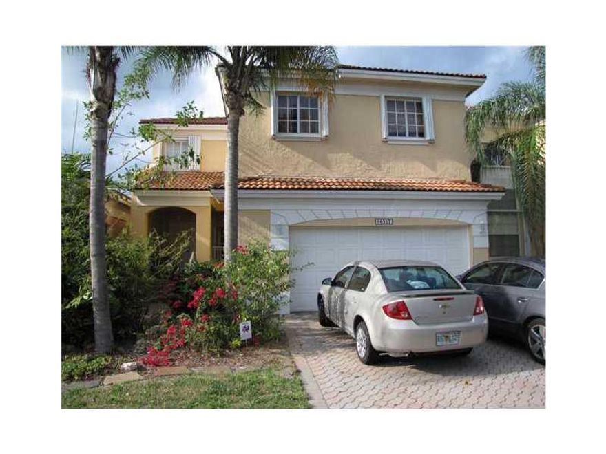 Large sized 4 bedroom townhome with high ceilings. Marble floors, just painted. Kitchen has wood cabinets, granite and stainless steel appliances. Double french doors and stamped concrete patio. 2 car garage. Great location and schools.