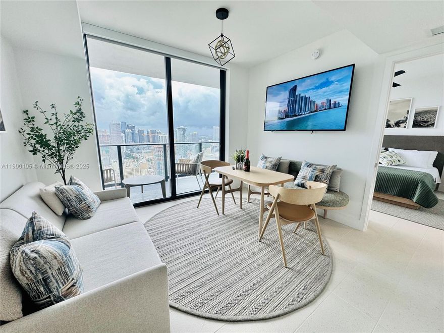 A beautifully furnished 1-bedroom residence featuring expansive city and bay views from the 43rd floor. This stylish home combines modern luxury and convenience — perfect for professionals, executives, or investors. The open layout offers a light-filled living space with floor-to-ceiling glass, European kitchen cabinetry, quartz countertops, and premium appliances. Balcony with a serene escape with panoramic skyline and water views—ideal for morning espresso or evening sunsets. Miami’s most dynamic towers, residents enjoy access to resort-style amenities including an infinity pool, spa, rooftop lounge, state-of-the-art fitness center, coworking and social spaces, and 24-hour security and valet. Steps away from Miami Worldcenter, Brightline Station, Kaseya Center, and Brickell nightlife.
