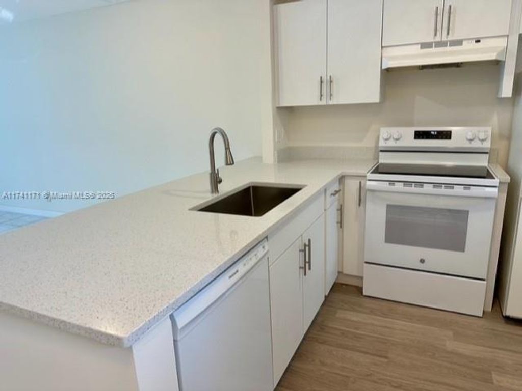 Photo of 5001 W Oakland Park Blvd #109, Lauderdale Lakes, FL 33313 (MLS # A11741171)