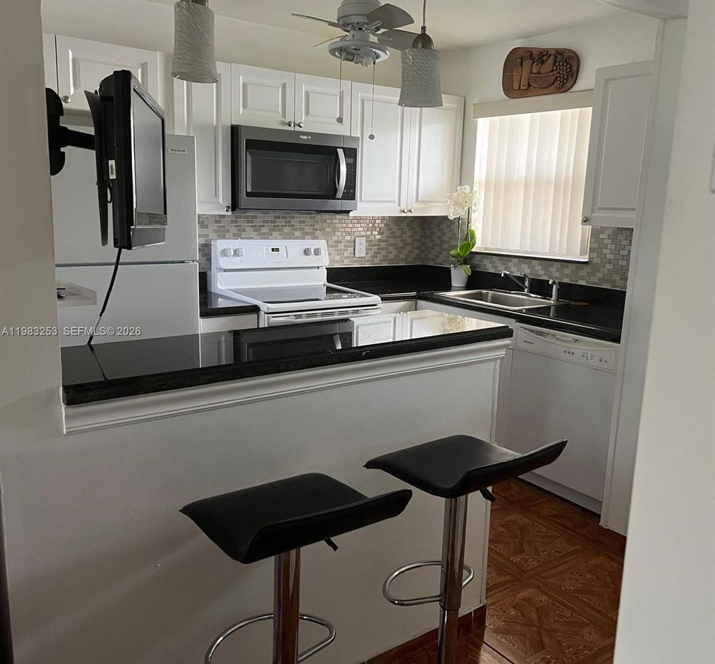 Photo of 8305 Sunrise Lakes Blvd #103, Sunrise, FL 33322 (MLS # A11983253)