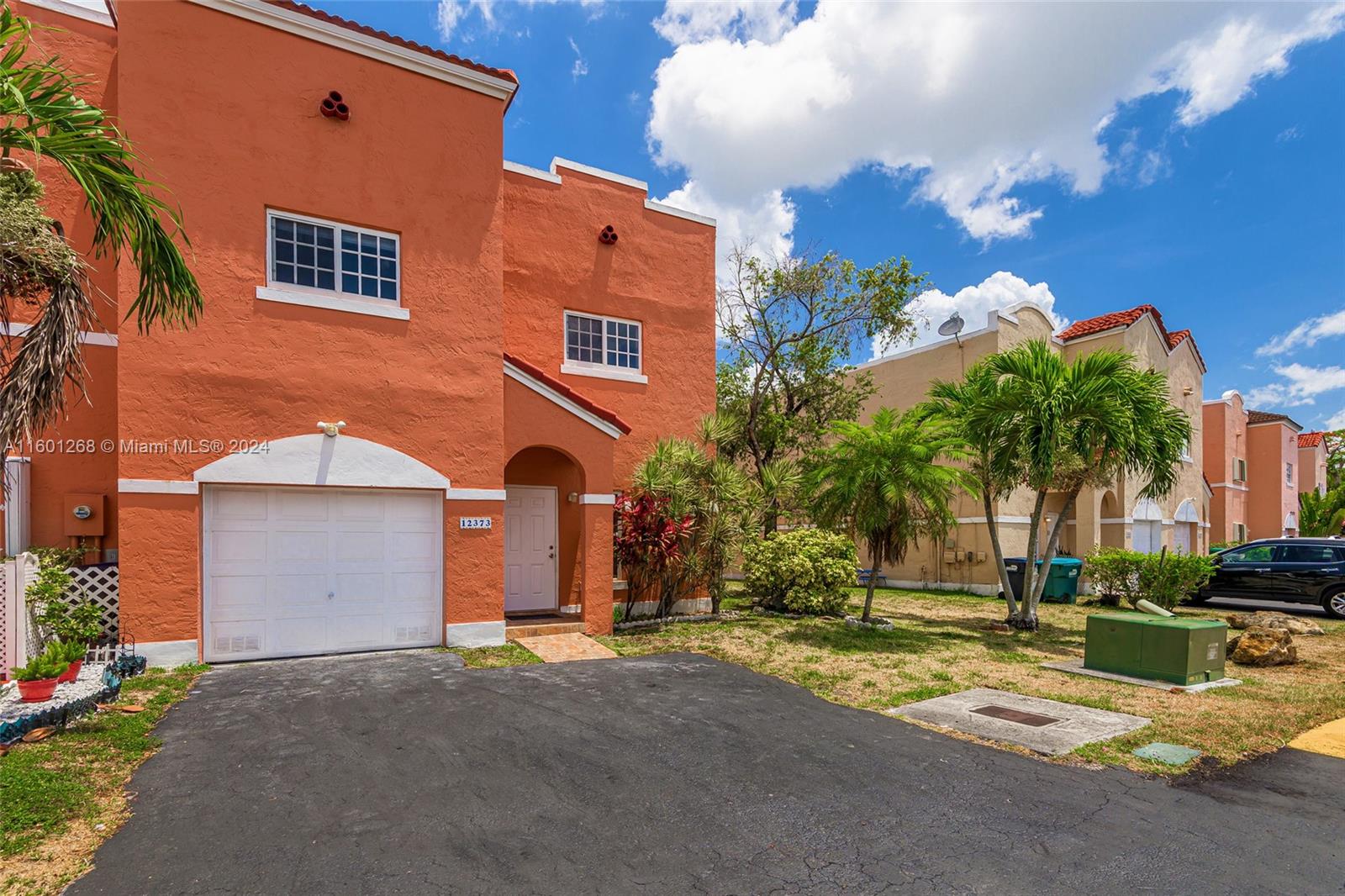 Live in luxury in large 4 bedrooms 2 ½ bathrooms townhouse with large kitchen, plenty of closets with great water view of pristine lake.  Freshly painted, new second floor and stairs flooring, new bath, new air conditioning and newer roof guaranteeing a stress-free home.  Impact resistance windows, garage and two assigned parking and much more. Located close to the Florida Turnpike, expressways and throughways in the much-desired Belen area. Situated near the Dolphin Mall, multiple restaurants and shops and great schools. 
Spectacular lake views from master bedroom, dining, living area and the enclosed patio.  Enjoy the best of Florida living from your covered and screened porch.
