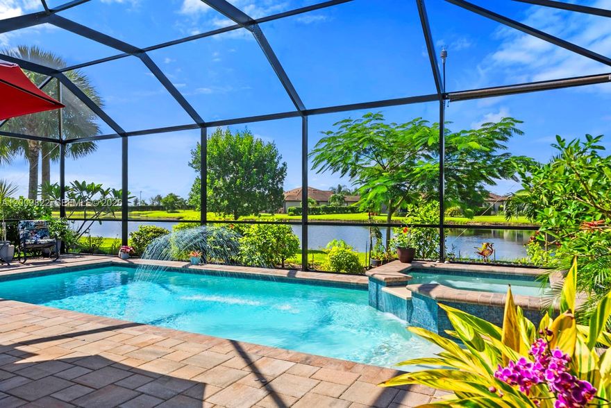 GOLF MEMBERSHIP • SALT WATER POOL/SPA • BREATHTAKING WATER VIEWS • Welcome to your dream home in the highly sought-after 55+ community of Del Webb Naples! This MYSTIQUE floor plan features 2 bedrooms plus a versatile den. Wake up to lakefront SUNRISES from the front of your home, then unwind in the evening with unforgettable SUNSETS from your private pool and spa. With PAID-IN-FULL SOLAR PANELS, enjoy dramatically reduced utility costs while also sustainably heating your pool and spa. Inside, the GOURMET KITCHEN impresses with a spacious island and custom light gray soft-close cabinetry with pull-outs. The inviting PRIMARY SUITE offers dual sinks, a walk-in shower, and a generous walk-in closet. The flexible den provides the perfect space for guests, a home office, or hobbies. Seamless indoor-outdoor living is yours with ZERO-CORNER POCKET SLIDERS opening to the LARGE EXTENDED LANAI, a true retreat featuring a HEATED SALTWATER POOL & SPA, CUSTOM SUN SHADES, and ELECTRIC HURRICANE SCREENS for comfort and peace of mind. The TANDEM GARAGE offers additional space for cars, a golf cart, or storage, complete with epoxy flooring, a bike/kayak rack, insulated garage door, and even air conditioning. Designer touches abound, including WHOLE HOUSE WATER PURIFICATION SYSTEM, on the diagonal tile flooring, and BRAND-NEW UPGRADED CARPET in the bedrooms.