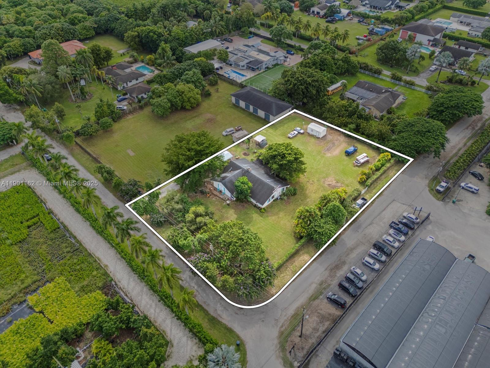 Welcome to this spacious corner-lot single-family home nestled on nearly half an acre in the highly desirable South Dade/Redland area. Offering 1,818 sq. ft. of living space, this 3-bed, 2-bath residence combines privacy, comfort, and exceptional potential. The home features a convenient single-level floor plan with well-defined living spaces. Zoned agricultural & located in a non-flood zone, the 0.48-acre lot allows for gardening, farming, raising chickens, or adding a pool, workshop etc. Peaceful & less congested than central Miami neighborhoods, this location offers a tranquil lifestyle while remaining close to major routes: US-1, Florida’s Turnpike, shopping and all essentials. This home invites buyers to either update and modernize it or embrace its retro, vintage Old Florida style!