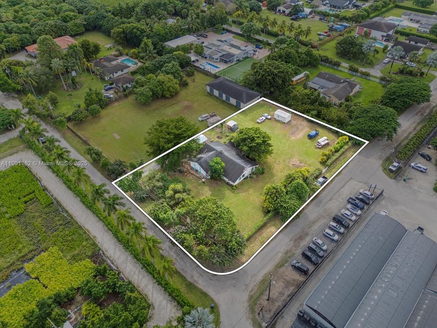 Welcome to this spacious corner-lot single-family home nestled on nearly half an acre in the highly desirable South Dade/Redland area. Offering 1,818 sq. ft. of living space, this 3-bed, 2-bath residence combines privacy, comfort, and exceptional potential. The home features a convenient single-level floor plan with well-defined living spaces. Zoned agricultural & located in a non-flood zone, the 0.48-acre lot allows for gardening, farming, raising chickens, or adding a pool, workshop etc. Peaceful & less congested than central Miami neighborhoods, this location offers a tranquil lifestyle while remaining close to major routes: US-1, Florida’s Turnpike, shopping and all essentials. This home invites buyers to either update and modernize it or embrace its retro, vintage Old Florida style!